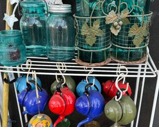 metal stand with jars and collector enamel pots