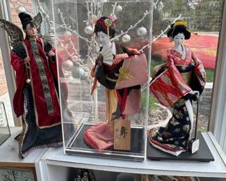 Asian dolls, white storage shelving & décor