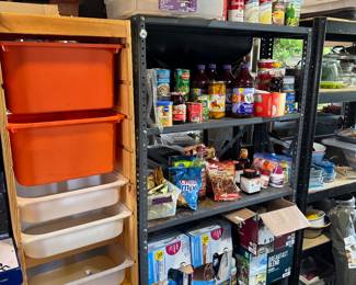 wood shelf with plastic bins on slots, metal shelves, left over pantry items, cleaners, and kitchenware dishes