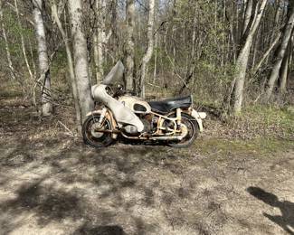 1966 R60 BMW (has sidecar as well)15,000 miles on it. It ran when it was put in shed years and years ago. But, yes, needs restoration.