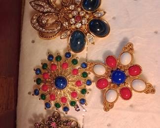 costume jewelry brooches, earrings, necklaces, and bracelets