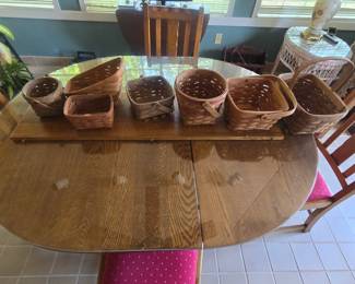 vintage tiger oak kitchen table with leaf and chairs comes with a glass top, and a Longaberger basket collection