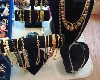 costume jewelry brooches, earrings, necklaces, and bracelets