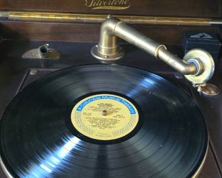 antique Silvertone Phonograph in amazing condition and working comes with lots of records and extra needles etc