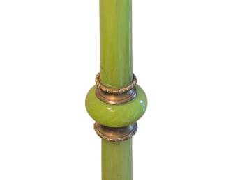 Green glass plant stand has crack in middle