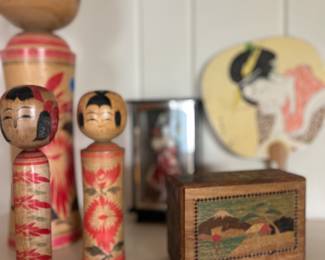 Vintage wooden Kokeshi dolls. Antique Japanese wooden puzzle box.