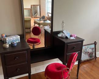 Antique vanity, vintage red cushioned chair.