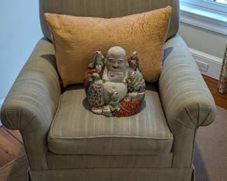 See, even Buddha likes to chillax in this comfy upholstered armchair.