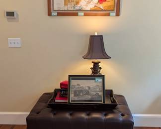 Leather hassock, wooden serving tray, contemporary books, vintage bronze Asian table lamp and amazing original oil on board, by Alfred Leslie Buell, 1910-1996.