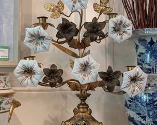 Close-up of one of the antique French brass and painted porcelain altar candelabra, for 5 candles.