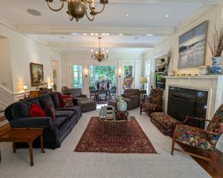 Embossed leather table, by Maitland-Smith, navy blue mohair sofa by Brunschwig and Fils "Saratoga Collection",vintage Persian hand-woven Lilihan Sarouk rug, measuring 5" 2" x 6' 8", pair of green/white Asian ginger jars on bentwood stands, pair of wooden armchairs, w/Brunschwig & Fils fabric, pair of matching window seat cushions.