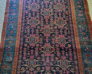 Another fantastic hand-woven Persian wool rug, measuring 4' 8" x 6' 6", atop a sisal rug.