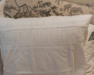 This German pillow sham states "Gute Nacht", "Good Night" in German. There are some very nice Euro linens in this house.