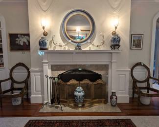 Quiet den, vintage hand-woven Persian Bakhtiari rug, antique French brass fire screen, VA Metalcrafters fire bumper, pair of antique Asian blue/white porcelain ginger jars on stands, contemporary blue/gold wall mirror, pair of amazing ABCG epergne, w/5 bud vases each and stunning pair of antique French Louis XV carved wood chair frames.