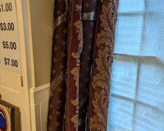 Rolls of upholstery fabric in the garage.