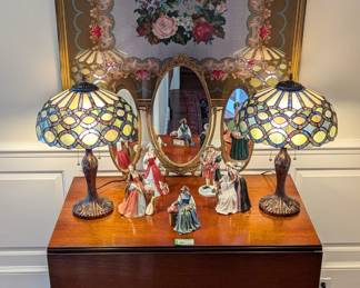 1940's mahogany drop-leaf dining table, w/leaf, pair of Tiffany-style stained glass table lamps, vintage brass triple tabletop mirror, set/5 Royal Doulton (England) porcelain Henry VIII artist-signed porcelain figurines and nicely framed needlepointed floral panel, made by a a guy named J. Haran, in 1976, I don't know all of his pronouns though.