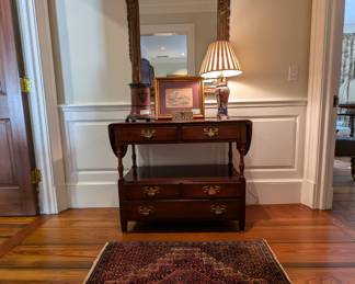 Vintage drop-leaf mahogany console table, by Pennsylvania House, Asian porcelain table lamp, mixed metals vase and large wall mirror, by Gampel-Stoll Co., 1971 and Persian hand-woven wool Bijar rug, measures 2' 5" x 3' 4".