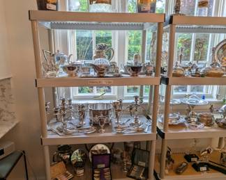 Welcome to the silver plated and sterling silver section of the sale. There is holloware, candlesticks, boxed sets of flatware, trivets, trophies, teapots, wine coasters, etc. Also a few vintage wine bottles.