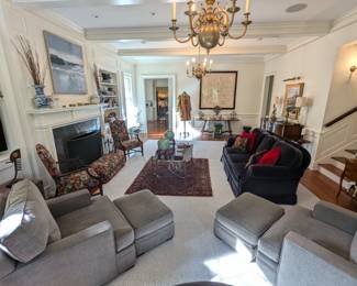 Long view of the great room, with pair of down-filled Pottery Barn upholstered armchairs, with matching ottomans, pair of wooden armchairs, with Brunschwig and Fils fabric, navy mohair sofa, "Saratoga Collection" by Brunschwig and Fils; measures 31" h x 81" w x 33" d.