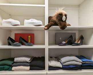 A few pair of women's shoes, size 8 1/2 and cashmere sweaters.