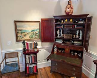Nicely framed, artist-signed original oil on canvas, one of a pair of wood/rattan armchairs, w/upholstered cushions, one of a pair of mahogany two-shelf bookcases, two different bronze statues and two-piece drop-front mahogany secretary, ca. 1790.