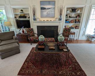 Black/gold faux twig cast iron Chinoiserie tray table, by Dennis & Leen, L.A., measure 33" D x 50" W x 20" H, vintage Persian hand-woven Lilihan Sarouk rug, measuring 5" 2" x 6' 8", pair of green/white Asian ginger jars on bentwood stands, pair of wooden armchairs, w/Brunschwig & Fils fabric, pair of matching window seat cushions, hand-painted Indonesian trunk, one of a pair of matching Pottery Barn upholstered armchairs, w/matching ottomans, pair of Asian blue/white porcelain vases, pair of French porcelain fruit coolers, and nicely framed original blue/white oil on canvas seaside scene.