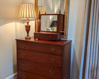 Antique mahogany 4-drawer chest, vintage mahogany shaving mirror, by Biggs Furn. Co., vintage alabaster table lamp and gold beveled glass wall mirror, by Carolina Mirror Co.