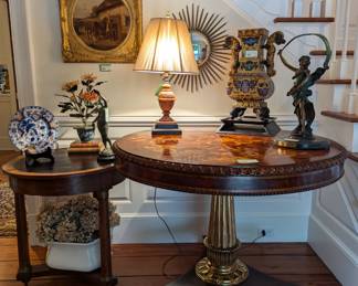 Inviting entrance hall, with antique Empire gueridon table, w/single drawer, leather top, 25 1/2" d x 28" t, gorgeous Maitland Smith inlaid table, w/bradd column base and lion feet, marble table lamp, w/string shade, vintage Asian cloisonne palace floor vase, two bronze female statues, English ironstone tub, w/dried hydrangeas, Asian stone flowers in cloisonne pot, antique equestrian motif original oil on canvas, by listed English artist, contemporary convex wall mirror and one of three Mason's (England) plates.