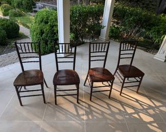 Set of fur fruitwood resin Chiavari stackable side chairs.