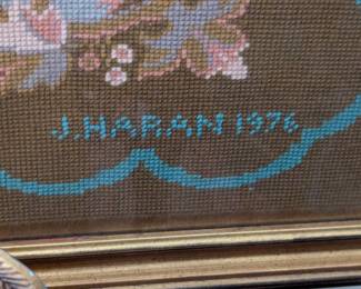 Artist's signature on the nicely framed needlepointed floral panel, made by a a guy named J. Haran, in 1976.