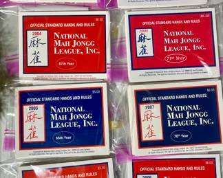 National Mah Jongg League Official Standard Hands and Rules books. Each year has a set of 4 except for 2003 has 3.  2002 through 2006