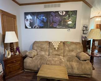 Beatles pictures, reclining couch and chair.