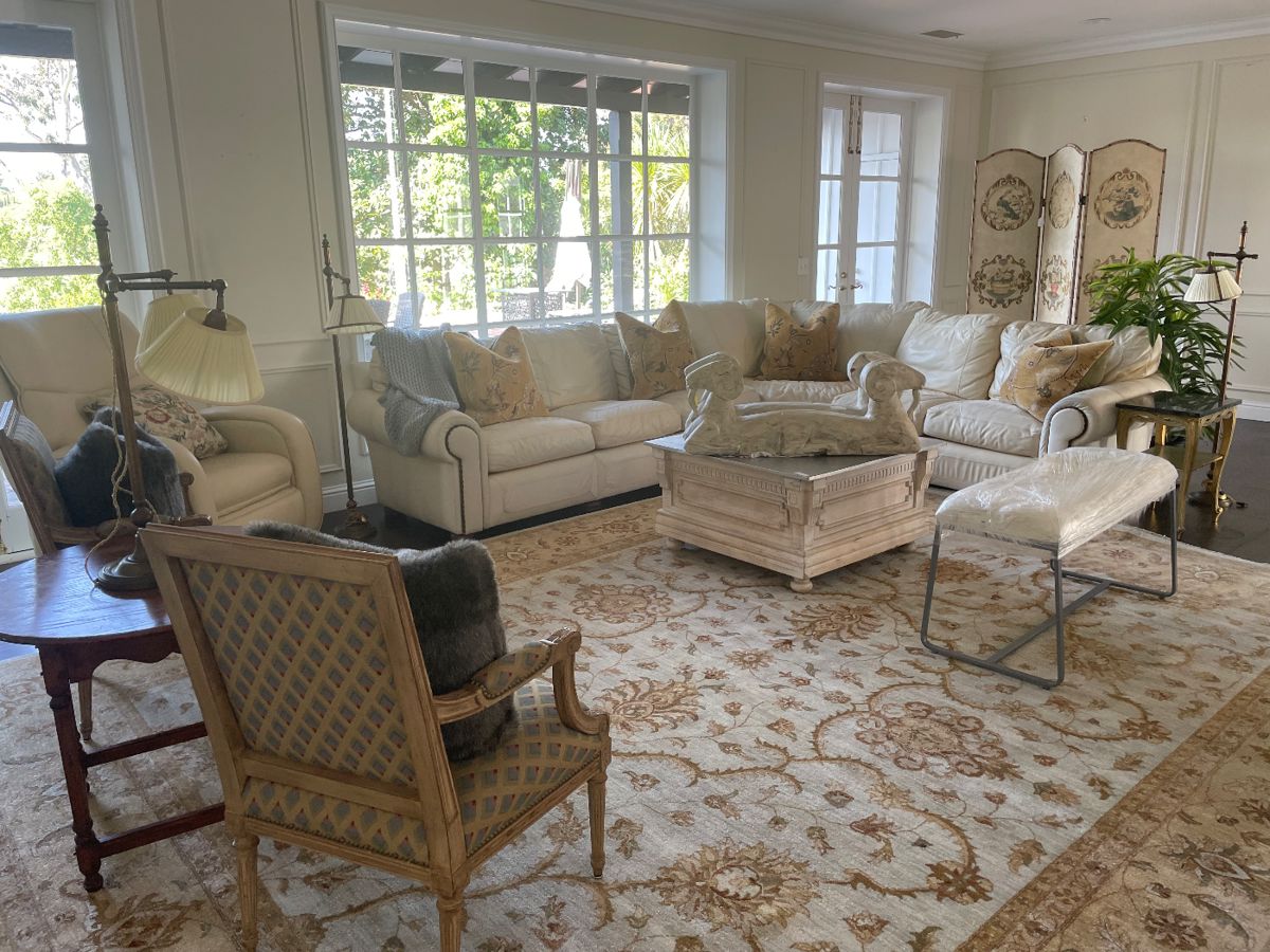 Beautiful leather large sofa, hand knotted rug, carved wood rams for a great coffee table or just as part of your decor. Fabulous MCM lamps, cool architectural coffee table and side tables, furniture bench, pr. of antique French chairs, leather massage chair. (It doesn’t recline). If interested in any large furniture we will do a presale only on big items.