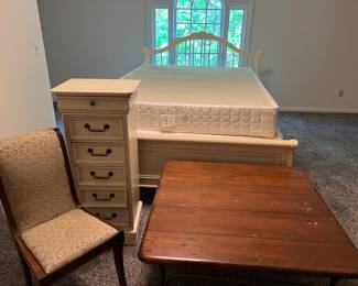 Queen bed, jewelry cabinet, coffee table and antique chair.