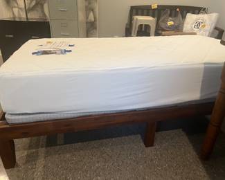Twin bed. Brand new Original Mattress Factory mattress, riser board and new bed frame