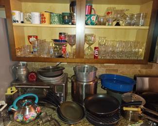More pots and pans and cups and glasses