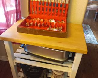 Silver flatware, service cart