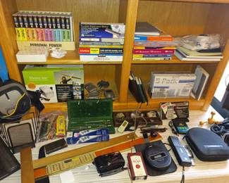 Various walkmans, drafting tools and headphones