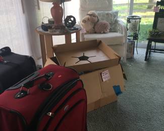 Wicker chair
Luggage
Table
Candle stand