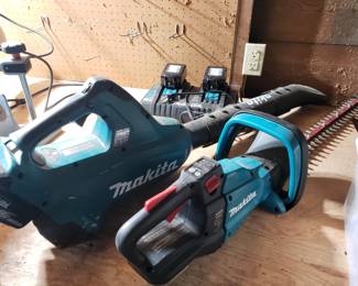 Makita battery powered leaf blower, hedge trimmer, and screwdriver. Dual station charger.