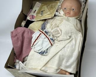 Lot 207 | Baby Doll in Box with Doll Clothes Clothing
