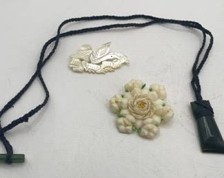 Lot 340 | Carved Jade Totem Necklace, Carved Shell Brooch
