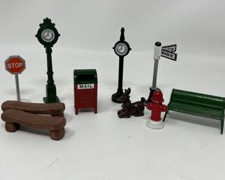 Lot 178 | Cast Metal Christmas Village Signs Bench