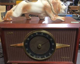 Old dial feature AM/FM radio with midcentury lion planter