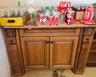 Beautiful cabinet waiting for a quartz top to be made into a kitchen island or a double sink for a master bath.
Plus Coke collectables
