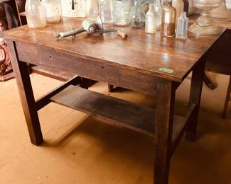 Great old kitchen table w/ old bottles