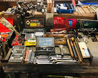 Yessir Mister, we got Tons of Tools and an old workbench.