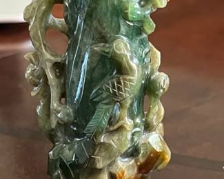 small carved jade vase with stand