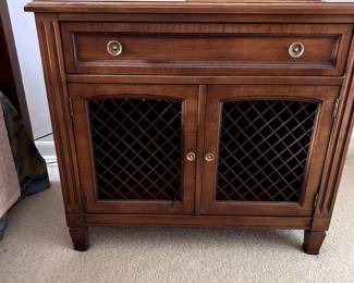 pair of Kindel bedside chests with wire inset doors