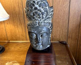 heavy carved stone Asian figure on rosewood base
